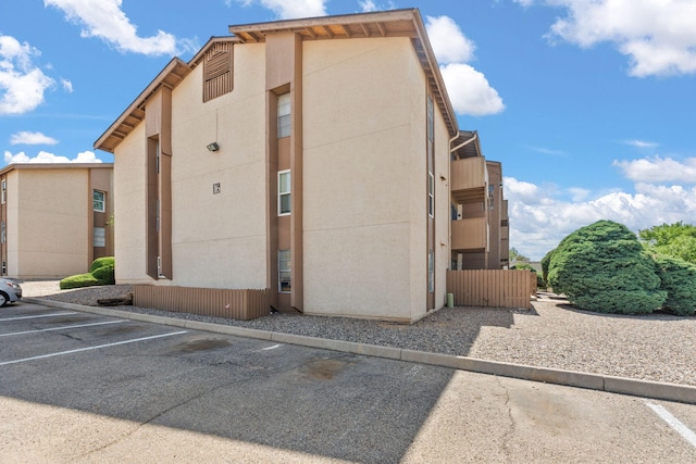 3867 Montgomery Blvd NE Unit 1633, Albuquerque, NM 87109 - view of building exterior featuring uncovered parking