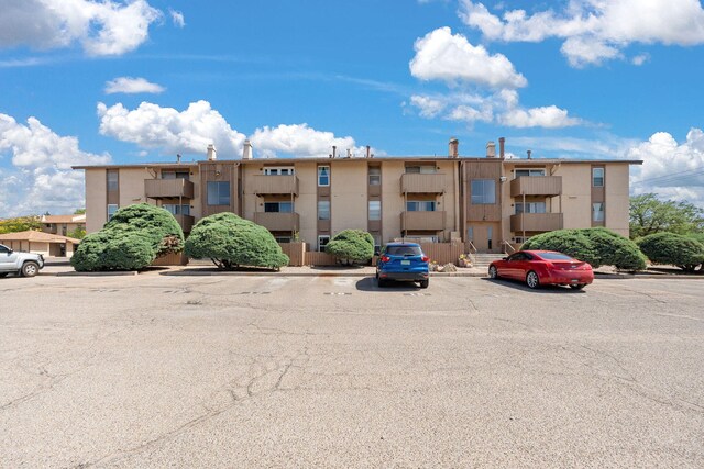 3867 Montgomery Blvd NE Unit 1633, Albuquerque, NM 87109 - view of building exterior with uncovered parking
