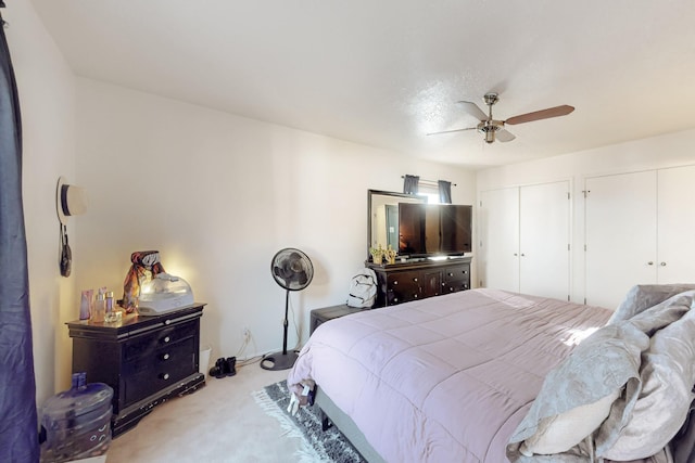 648 Frederico Blvd, Rio Communities, NM 87002 - bedroom with light colored carpet, two closets, and a ceiling fan