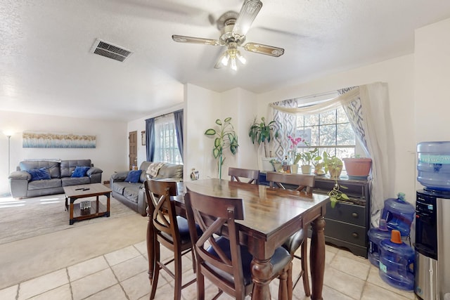 648 Frederico Blvd, Rio Communities, NM 87002 - dining area featuring light carpet, light tile patterned floors, plenty of natural light, ceiling fan, and a textured ceiling