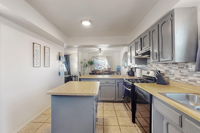 648 Frederico Blvd, Rio Communities, NM 87002 - kitchen with black dishwasher, a peninsula, gray cabinetry, light tile patterned floors, and gas stove