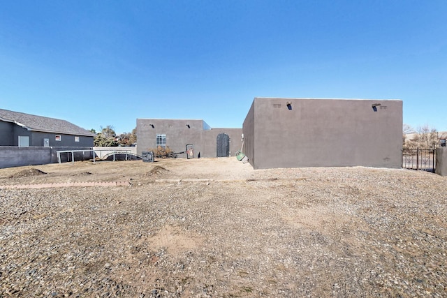 648 Frederico Blvd, Rio Communities, NM 87002 - rear view of property featuring stucco siding