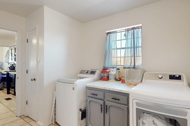 648 Frederico Blvd, Rio Communities, NM 87002 - laundry area with washing machine and clothes dryer, cabinet space, and light tile patterned floors