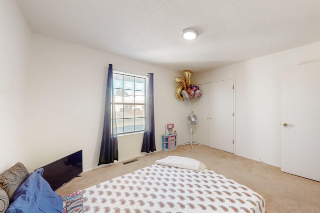 648 Frederico Blvd, Rio Communities, NM 87002 - bedroom with light carpet and a textured ceiling