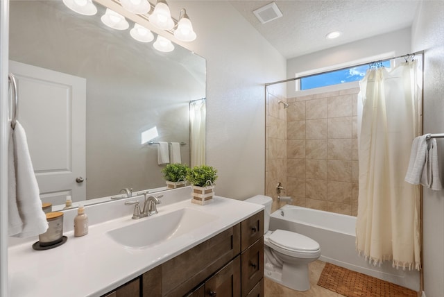 3217 Vatapa Rd NE, Rio Rancho, NM 87144 - bathroom featuring vanity, toilet, shower / bath combination with curtain, and a textured ceiling