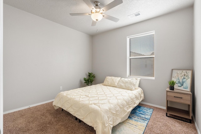 3217 Vatapa Rd NE, Rio Rancho, NM 87144 - carpeted bedroom with baseboards, a textured ceiling, and a ceiling fan