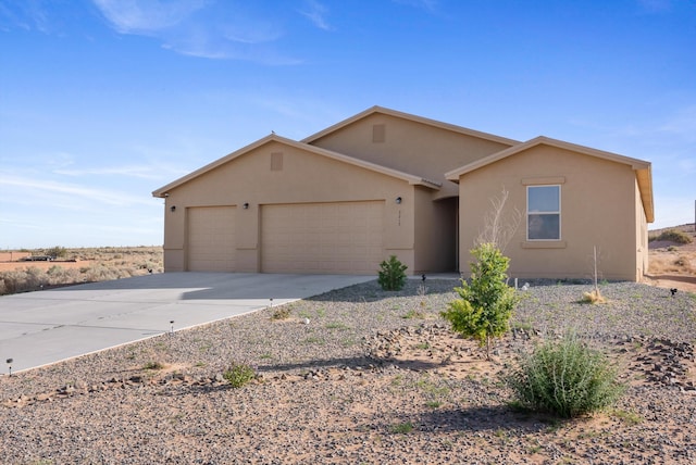 3217 Vatapa Rd NE, Rio Rancho, NM 87144 - single story home featuring stucco siding, an attached garage, and concrete driveway