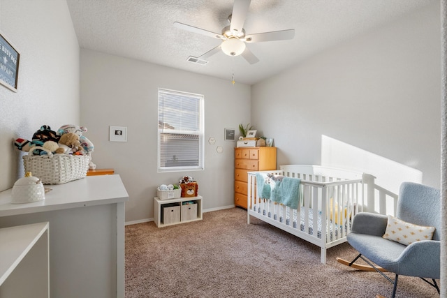 3217 Vatapa Rd NE, Rio Rancho, NM 87144 - bedroom with a nursery area, carpet flooring, ceiling fan, and baseboards