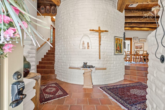 1572 Eagle Ridge Ct NE, Albuquerque, NM 87122 - stairway with beamed ceiling and brick wall