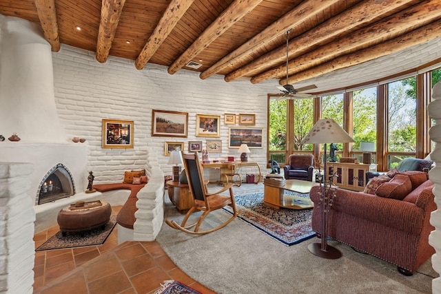 1572 Eagle Ridge Ct NE, Albuquerque, NM 87122 - living room with wooden ceiling with exposed beams, tile patterned floors, a ceiling fan, and a fireplace with raised hearth