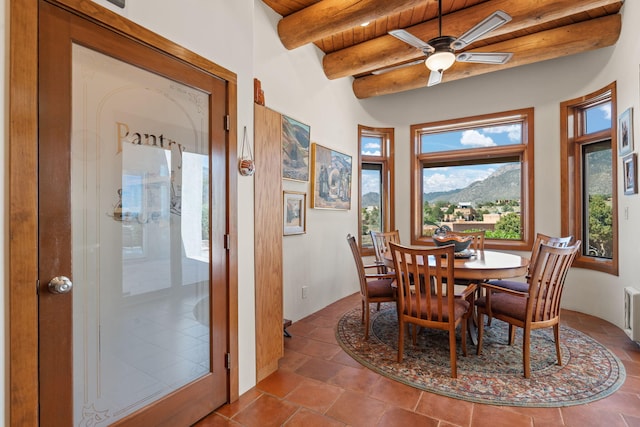 1572 Eagle Ridge Ct NE, Albuquerque, NM 87122 - dining room featuring wooden ceiling with exposed beams, ceiling fan, and a mountain view