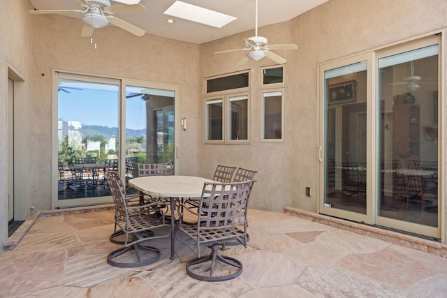 1572 Eagle Ridge Ct NE, Albuquerque, NM 87122 - sunroom / solarium with a skylight and a mountain view
