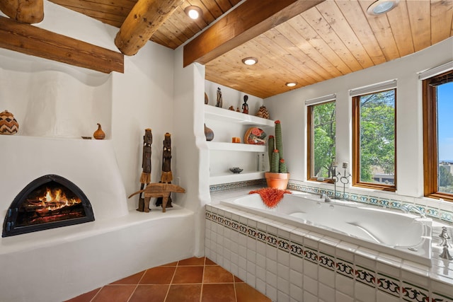 1572 Eagle Ridge Ct NE, Albuquerque, NM 87122 - bathroom featuring wooden ceiling with exposed beams, a relaxing tiled tub, tile patterned floors, a lit fireplace, and recessed lighting