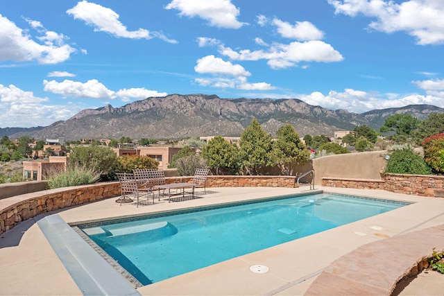 1572 Eagle Ridge Ct NE, Albuquerque, NM 87122 - outdoor pool with a mountain view and a patio