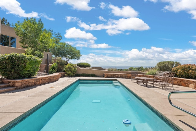 1572 Eagle Ridge Ct NE, Albuquerque, NM 87122 - view of swimming pool featuring a patio