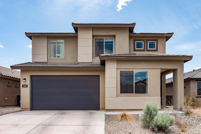 1608 Mammoth Way, Albuquerque, NM 87120 - prairie-style home with a garage, stucco siding, and concrete driveway