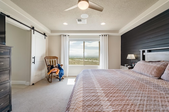1608 Mammoth Way, Albuquerque, NM 87120 - bedroom featuring a barn door, a textured ceiling, carpet flooring, a ceiling fan, and recessed lighting