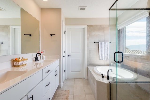 1608 Mammoth Way, Albuquerque, NM 87120 - full bathroom featuring a bath, double vanity, tile patterned flooring, and a shower stall