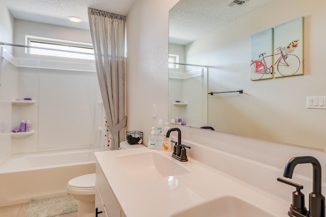 1608 Mammoth Way, Albuquerque, NM 87120 - full bath with toilet, a textured ceiling, vanity, washtub / shower combination, and tile patterned floors