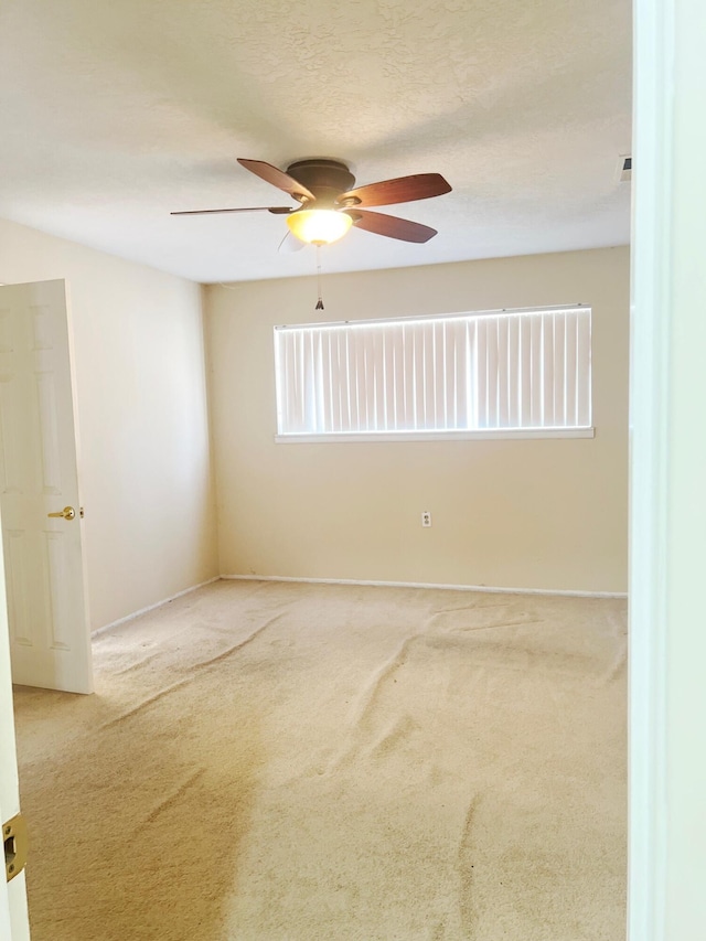 10008 Greene Ave NW, Albuquerque, NM 87114 - empty room featuring ceiling fan, carpet floors, and baseboards