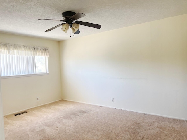 10008 Greene Ave NW, Albuquerque, NM 87114 - unfurnished room with carpet flooring, ceiling fan, baseboards, and a textured ceiling
