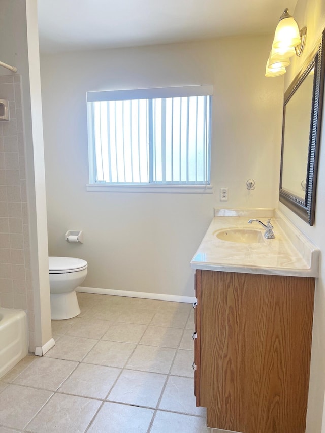 10008 Greene Ave NW, Albuquerque, NM 87114 - full bathroom featuring vanity, tile patterned floors, toilet, baseboards, and bathtub / shower combination