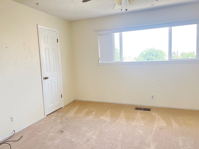 10008 Greene Ave NW, Albuquerque, NM 87114 - carpeted empty room with ceiling fan