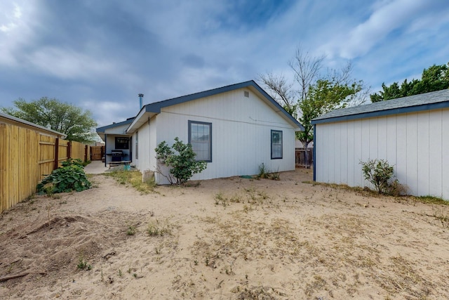 1128 Pandora Dr SW, Los Lunas, NM 87031 - rear view of house featuring a fenced backyard and a patio area