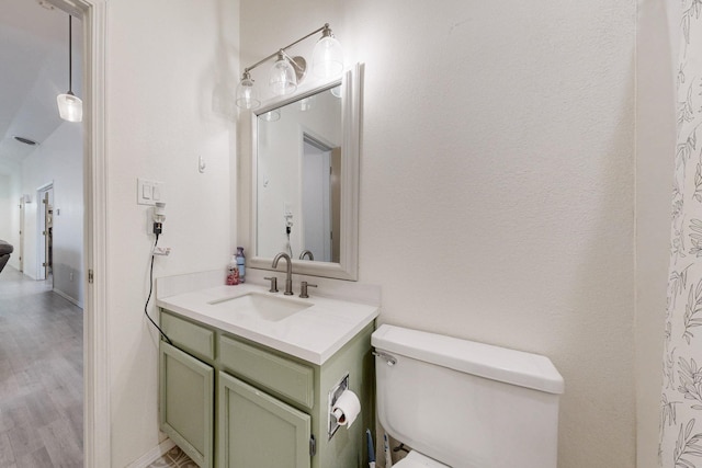 1128 Pandora Dr SW, Los Lunas, NM 87031 - bathroom with vanity, toilet, and wood finished floors