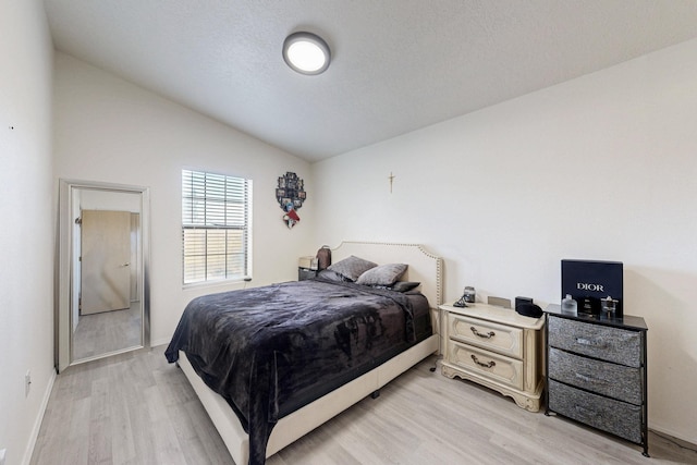 1128 Pandora Dr SW, Los Lunas, NM 87031 - bedroom with lofted ceiling, light wood-type flooring, and baseboards