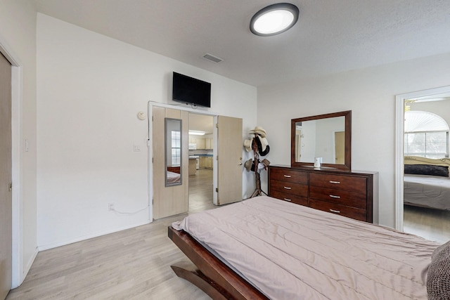 1128 Pandora Dr SW, Los Lunas, NM 87031 - bedroom with light wood-style floors and baseboards
