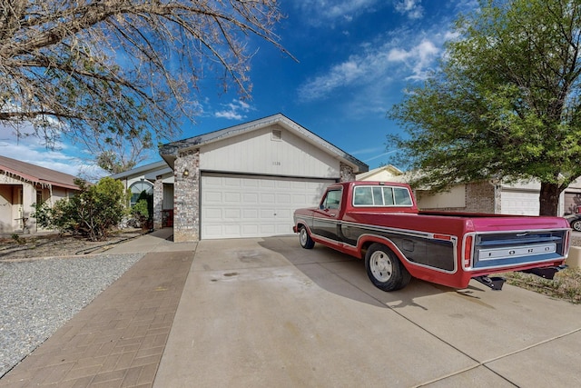 1128 Pandora Dr SW, Los Lunas, NM 87031 - ranch-style home with brick siding, a garage, and concrete driveway