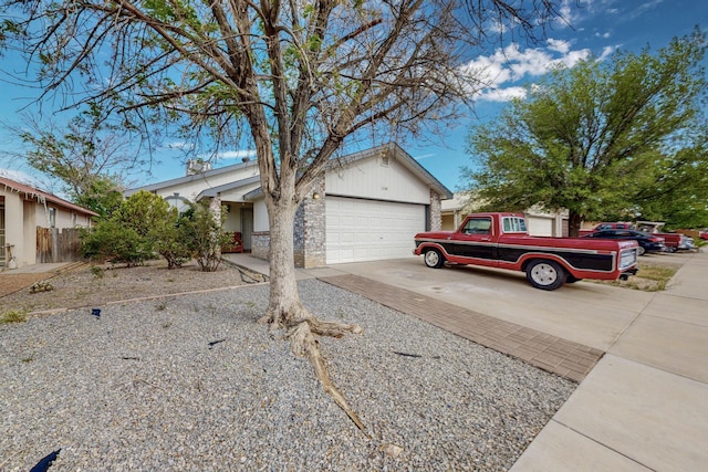 1128 Pandora Dr SW, Los Lunas, NM 87031 - view of front of property with driveway and an attached garage