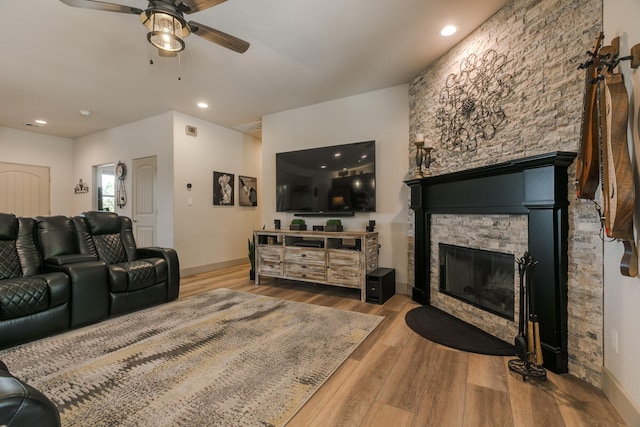 31 Express Blvd, Sandia Park, NM 87047 - living room featuring ceiling fan, a fireplace, wood finished floors, recessed lighting, and baseboards