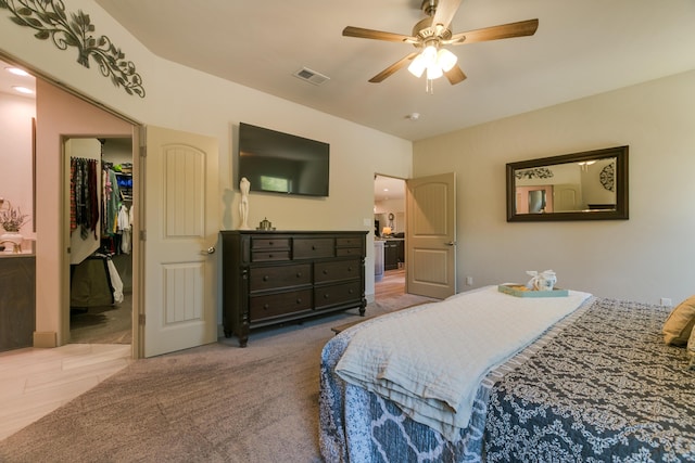 31 Express Blvd, Sandia Park, NM 87047 - bedroom with a walk in closet and ceiling fan