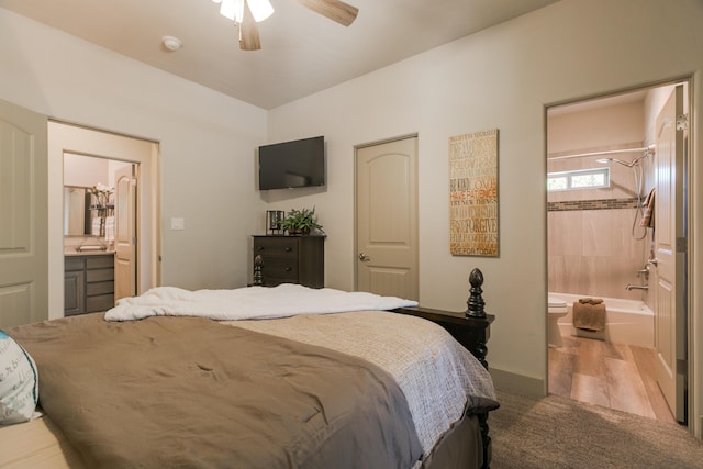 31 Express Blvd, Sandia Park, NM 87047 - carpeted bedroom featuring ensuite bath, ceiling fan, and baseboards