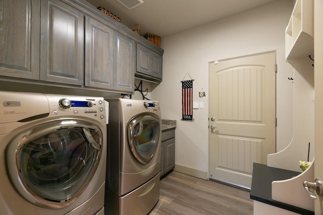 31 Express Blvd, Sandia Park, NM 87047 - laundry area with cabinet space, washing machine and clothes dryer, light wood-style floors, and baseboards