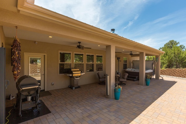 31 Express Blvd, Sandia Park, NM 87047 - view of patio / terrace with a hot tub, a ceiling fan, and grilling area
