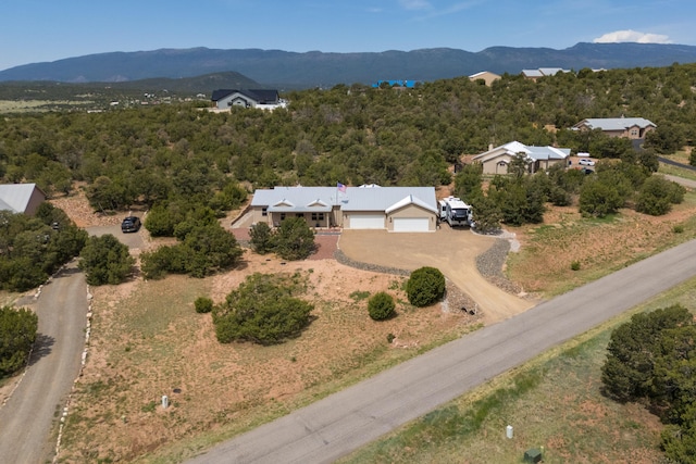31 Express Blvd, Sandia Park, NM 87047 - aerial view of property and surrounding area featuring a mountainous background and a forest