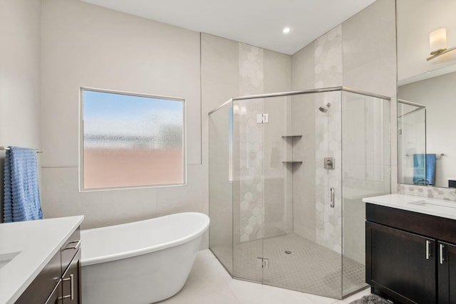 6527 Trestle Glen Rd NW, Albuquerque, NM 87120 - bathroom featuring vanity, a stall shower, and a soaking tub