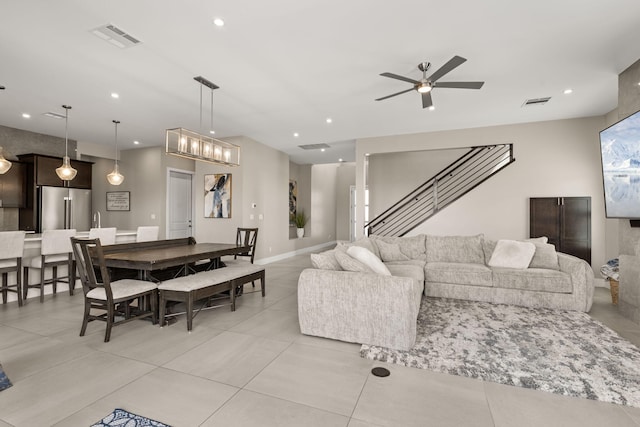 6527 Trestle Glen Rd NW, Albuquerque, NM 87120 - living room featuring a ceiling fan, light tile patterned flooring, recessed lighting, and baseboards