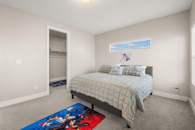 6527 Trestle Glen Rd NW, Albuquerque, NM 87120 - carpeted bedroom with baseboards, a walk in closet, and a closet