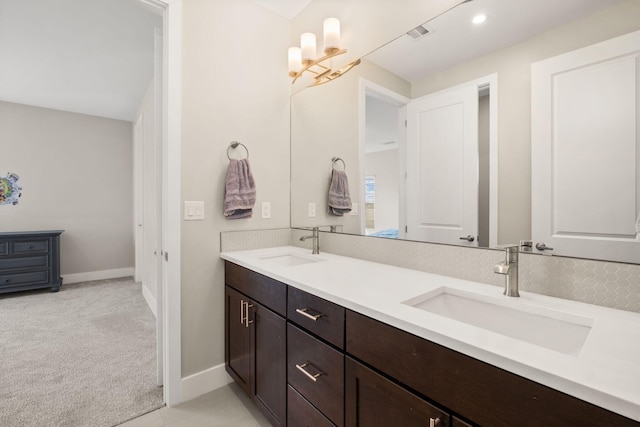 6527 Trestle Glen Rd NW, Albuquerque, NM 87120 - full bath featuring double vanity, baseboards, and a chandelier