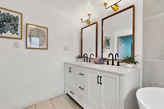 3801 Simms Ave SE, Albuquerque, NM 87108 - full bathroom with double vanity, a freestanding bath, and tile patterned flooring
