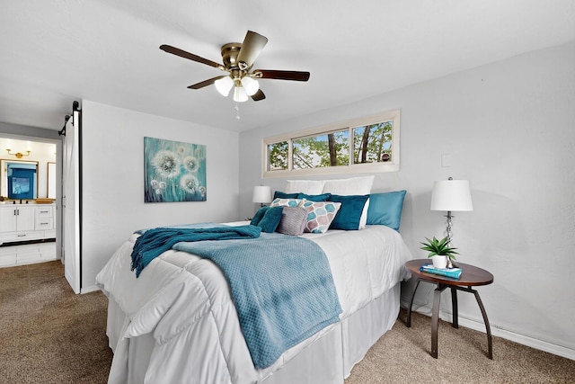 3801 Simms Ave SE, Albuquerque, NM 87108 - bedroom with carpet, a ceiling fan, ensuite bath, and a barn door
