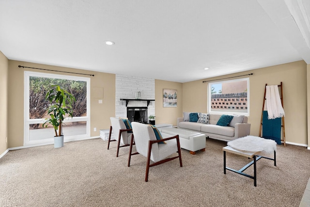 3801 Simms Ave SE, Albuquerque, NM 87108 - living room featuring carpet floors, a brick fireplace, and recessed lighting