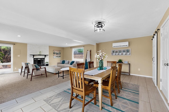 3801 Simms Ave SE, Albuquerque, NM 87108 - dining area with an AC wall unit and a stone fireplace