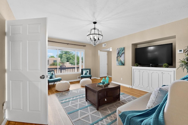 3801 Simms Ave SE, Albuquerque, NM 87108 - living area with wood finished floors and a chandelier