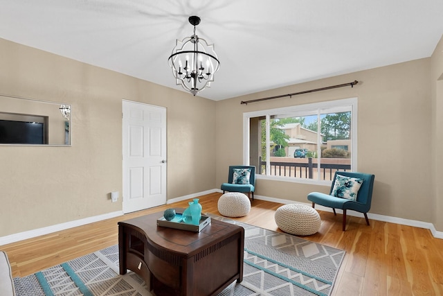 3801 Simms Ave SE, Albuquerque, NM 87108 - sitting room featuring wood finished floors and a chandelier