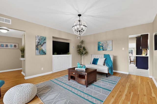 3801 Simms Ave SE, Albuquerque, NM 87108 - living area with wood finished floors and a chandelier